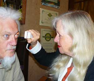 iridology, an iris examination using a handheld magnifying torch