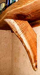 The shelf brackets are made from locally-sawn thick slices of sally wattle