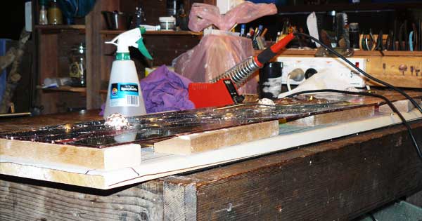 The flat glass soldered, time to add the crystals