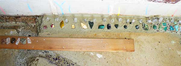 inserting the gemstones in the mortar