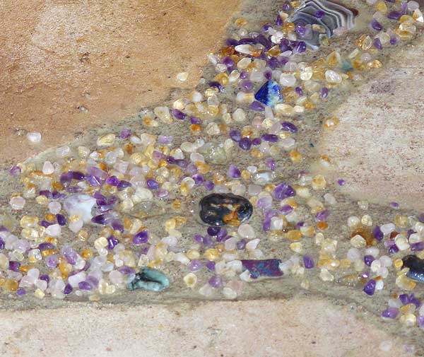 The chips sprinkled around the gemstones